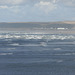 Looking over the beach and seeing the waves crashing