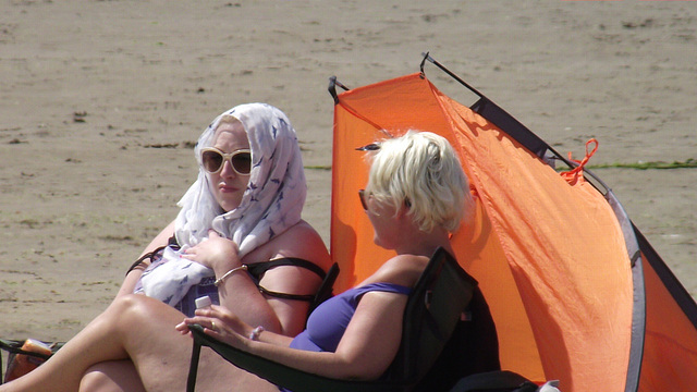 Two ladies sunning themselves