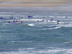 A surf school enjoying themselves