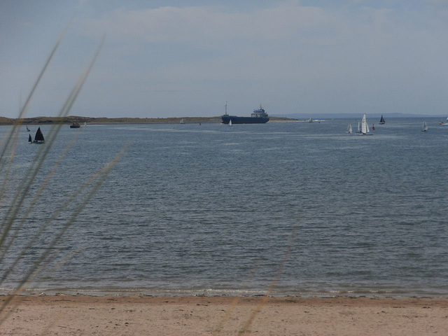 Large cargo vessel coming in with the tide