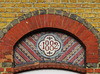 66 doric way,somers town, euston, london,1882 mosaic tilework tympanum on the  first floor of a row of shops.