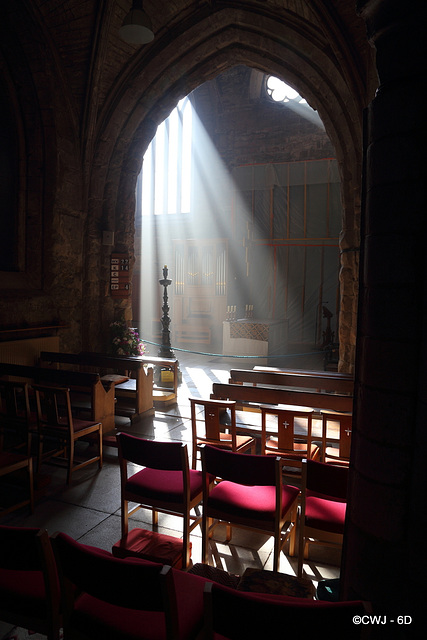 Morning sunlight streaming into Pluscarden Abbey