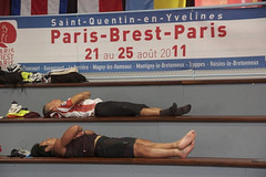 After PBP activity. Sleeping in the bleachers of Gymnase des Droits de l'Homme at the finish control in Guyancourt