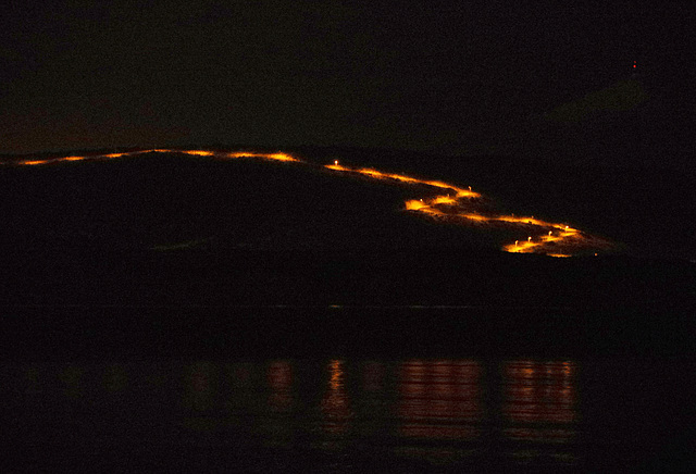 streetlights on a zig-zag road across the bay