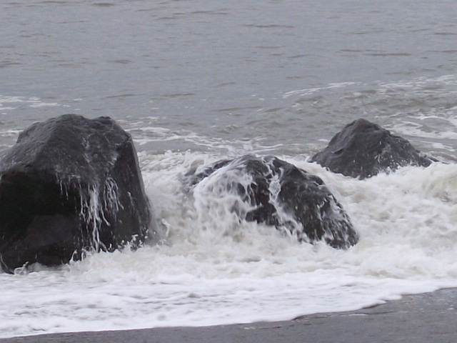 Three rocks braving the waves