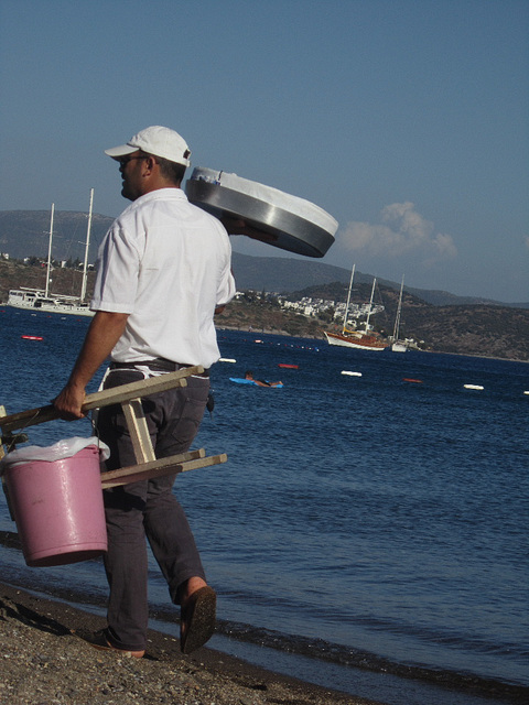 Man selling mussels and lemons