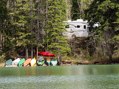 RV and colourful canoes.
