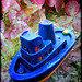 Tugboat in the sea of hortensias