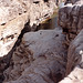 a small stream feeding on the rocks