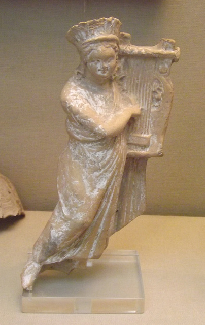 Terracotta Figure of a Woman Playing the Kithara with a Plectrum in the British Museum, April 2013
