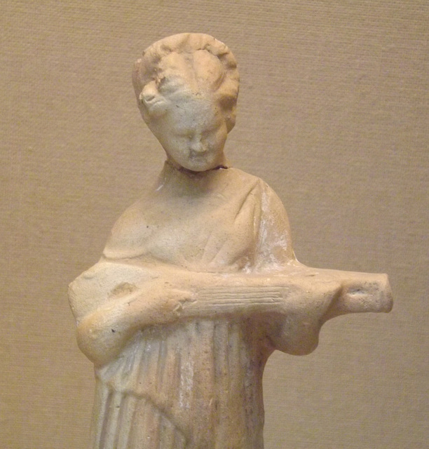 Detail of a Terracotta Figure of a Woman Playing a Type of Lute in the British Museum, April 2013