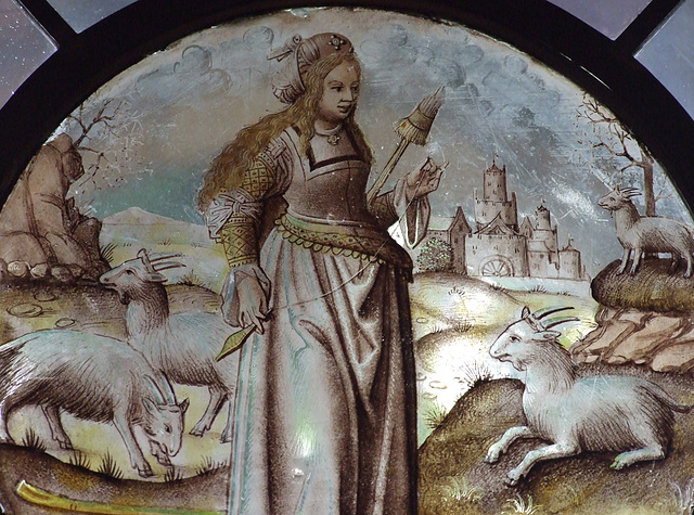 Detail of the Allegorical Figure: Goatherdess with Distaff and Spindle Stained Glass Roundel in the Cloisters, June 2011