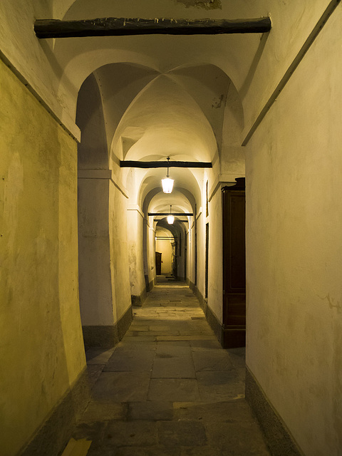 Evening lights in Oropa, Biella - Walking under the arcades of the cloister