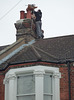 5. Pouring vermiculite insulation into the gap between the brick chimney and the flue liner