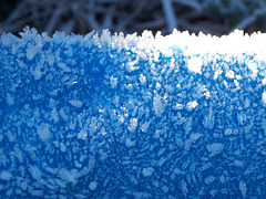 Hoar frost on a blue tarpaulin