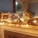 Fairy lights decorate my mantlepiece