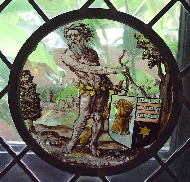 Wild Man Supporting a Heraldic Shield Stained Glass Roundel in the Cloisters, June 2011