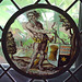 Wild Man Supporting a Heraldic Shield Stained Glass Roundel in the Cloisters, June 2011