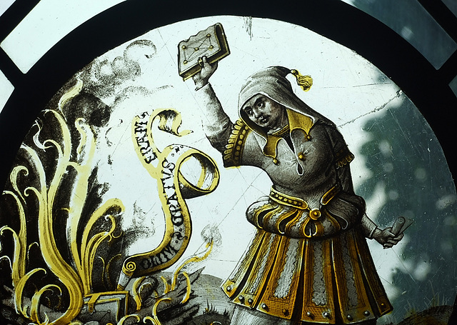 Detail of the Allegorical Scene with Bookburning Stained Glass Roundel in the Cloisters, June 2011