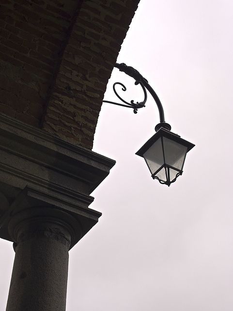 The lamppost on the gray sky