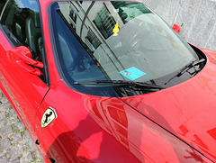 Perfect triangle: Ferrari, arbre magique and disabled person parking permit