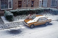 Clearing snow from a nice car ...