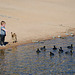 A children, a dog and the ducks