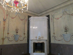 Stove in room corner.