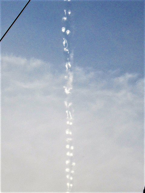 A vapour trail just above our house