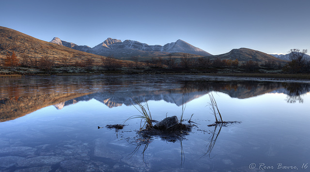 Last light on a tranquil lake, Rondane mountains.