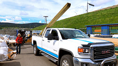 Loading long lumber on our truck.