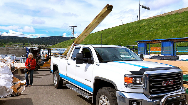 Loading long lumber on our truck.