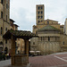 Italy, Arezzo, Water Well and Church of Santa Maria della Pieve on Piazza Grande
