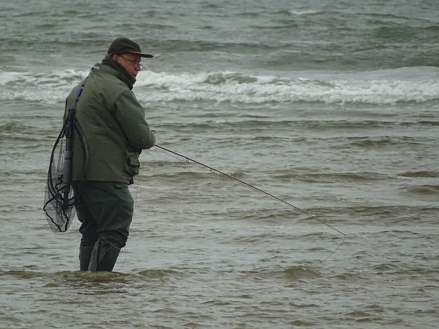 Man fly fishing for sea trout