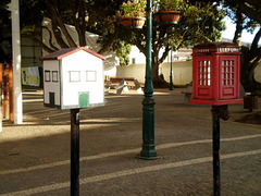 Telephone boxes of taxi rank.