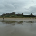 Bamburgh Castle and reflection in the wet sand