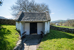 The lich gate of Llangar Old Church from inside the graveyard