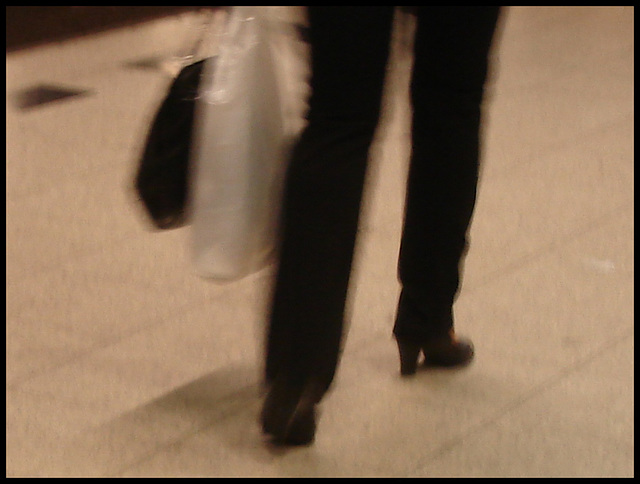 Train station high-heeled booted Lady