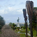 Greece, Sculpture of the Victorious Achilles in the Garden of the Achilleion Palace and the City of Kerkyra in the Background Greece, Sculpture of the Victorious Achilles in the Garden of the Achilleion Palace and the City of Kerkyra in the Background