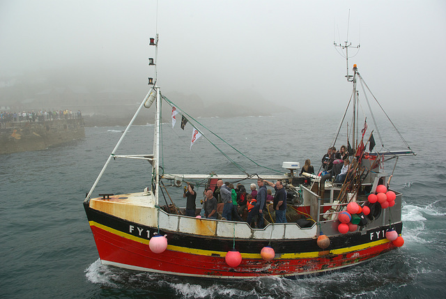 Boat race returning to Mevagissey Harbour