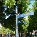 sunlight on an old blue signpost