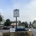 The Kings Arms pub sign and the High Street, Prestbury, Gloucestershire