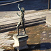 Sculpture in the centre of a pool.