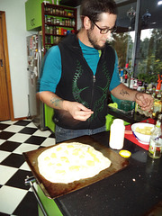 William making a French pizza