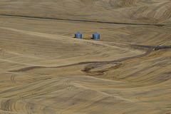 Farm Bins Among Hills