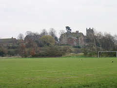Looking over the River Tame to Kingsbury Hall and the Church of St. Peter and St. Paul.