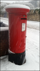 snowy red pillar box