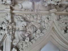 musician with portative organ on the c14 piscina canopy