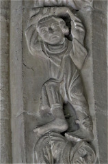 lawford church, essex , lively acrobats and musicians on window moulding around a c14 chancel window