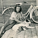 Girl with Bicycle, Dog, and Puppies